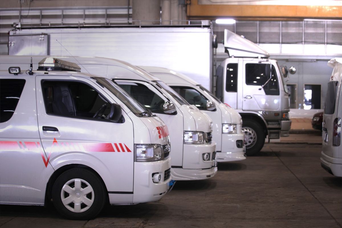 a lot of vans and truck for rent in case of emergency and for transportation parking in big garage